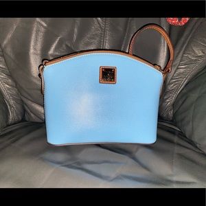 A Dooney and Burke purse in mint condition